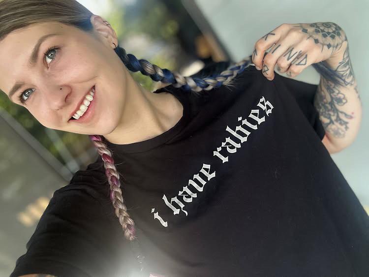 A local resident wears one of the trending commemorative t-shirts that have surfaced following the 2026 health crisis.