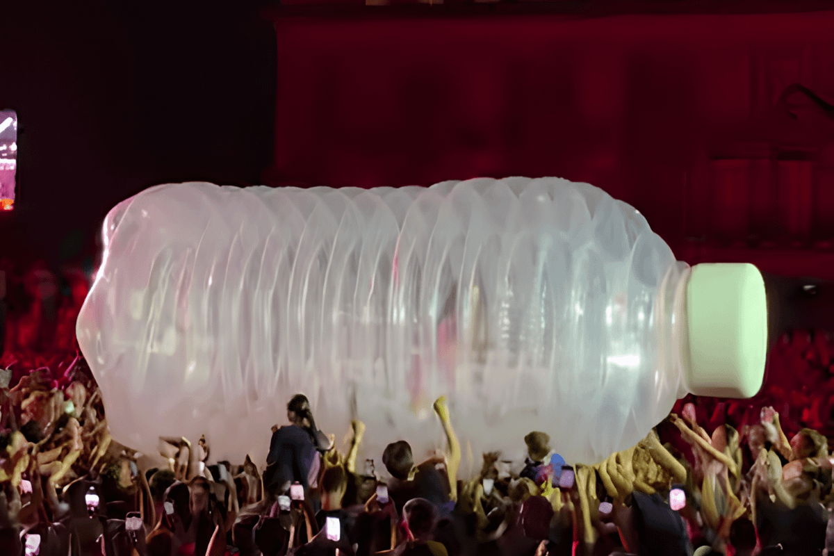 A giant inflatable prop is seen being held aloft by a crowd during a recent music festival performance.