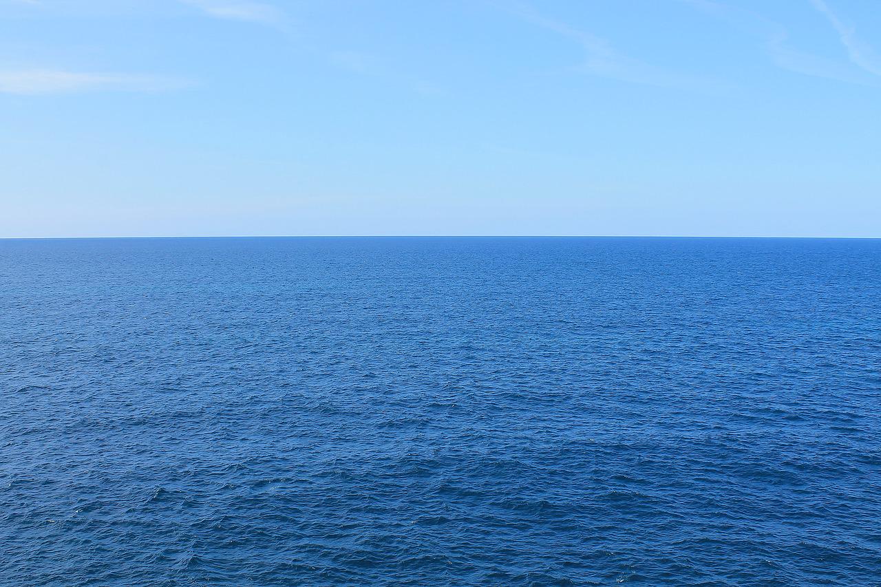 A vast expanse of blue water extends to the horizon.